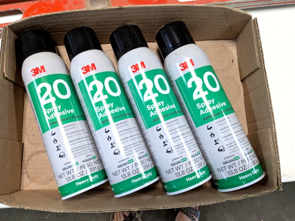 No shipping.  Four cans of 3M spray adhesive.
