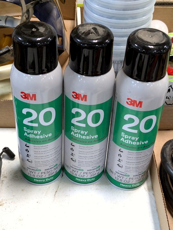 No shipping.  Three cans of 3M spray adhesive.