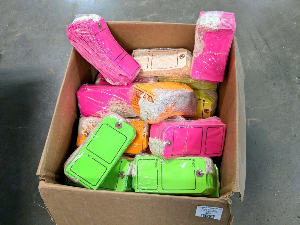 16" box is full of fluorescent string tags.