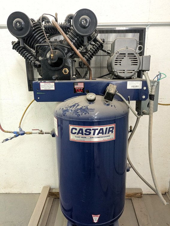 CastAir cast iron air compressor with an 80 gallon tank, 5 hp 230 volt motor and a dual cylinder pum