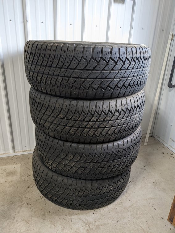 Bridgestone Duler A/T tires with good tread. Tires are P285/45 R22 and 110H.