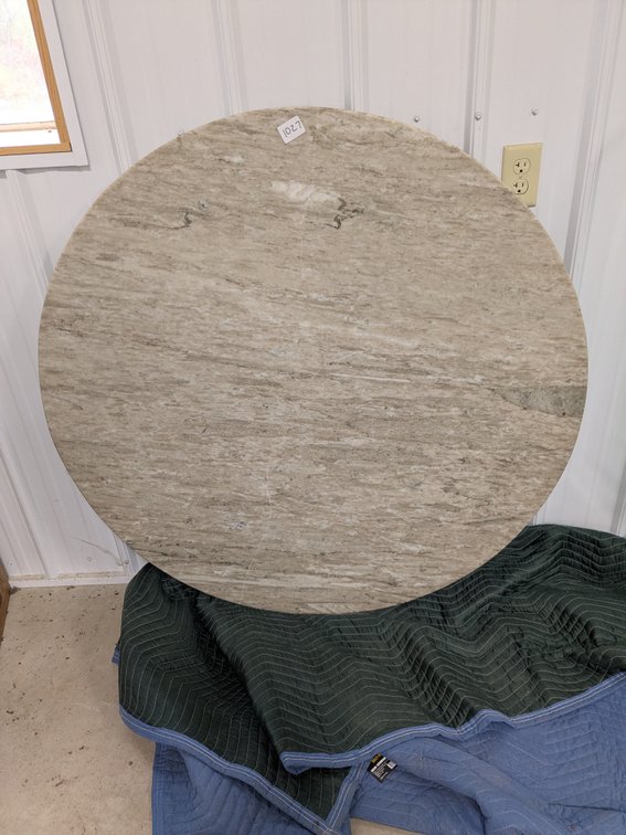 Beautiful stone or marble table top is 4' diameter - cracked but usable.