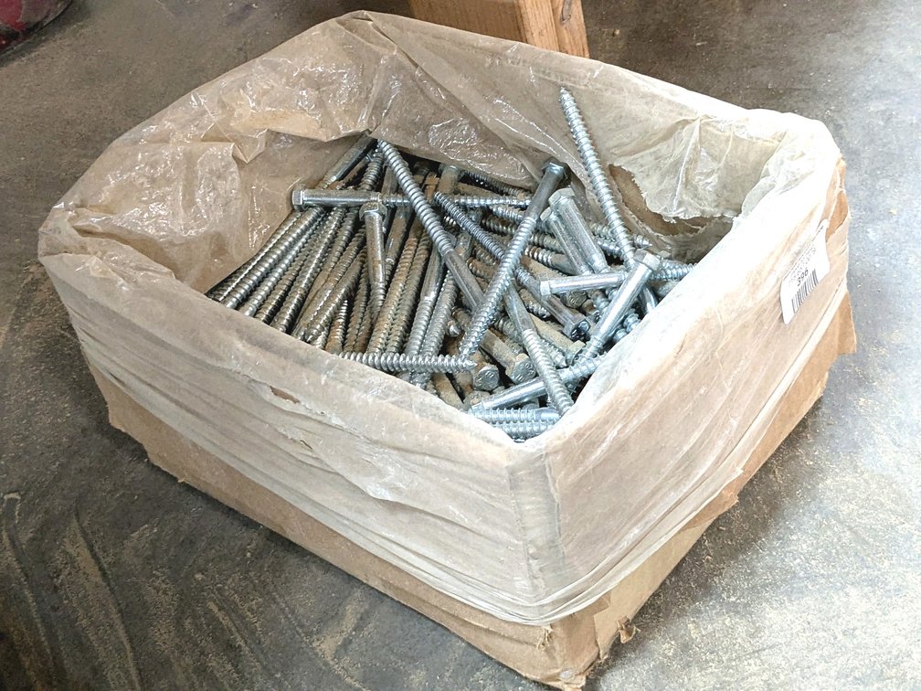 Lag bolts measure 6" x 3/16".  Box is 13" and about half full.