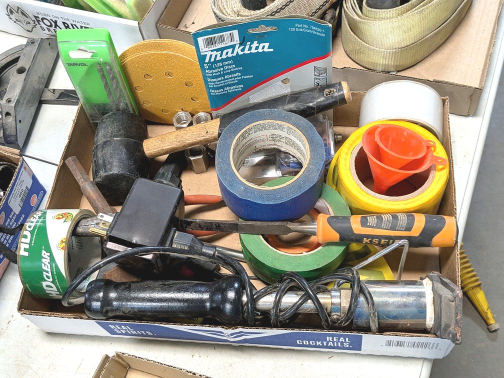 Duck tape, wood chisel, auger bit, Reclaimed Rustic Woodworks wood burn stamp and more.