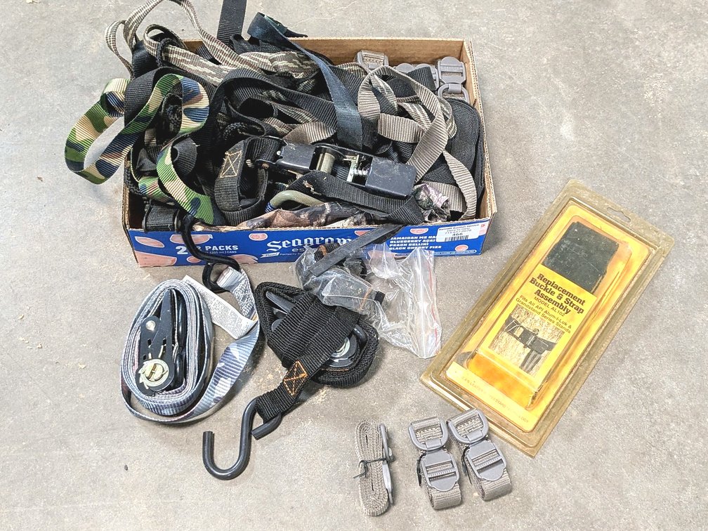 Several ratchet straps, camera straps, and more.