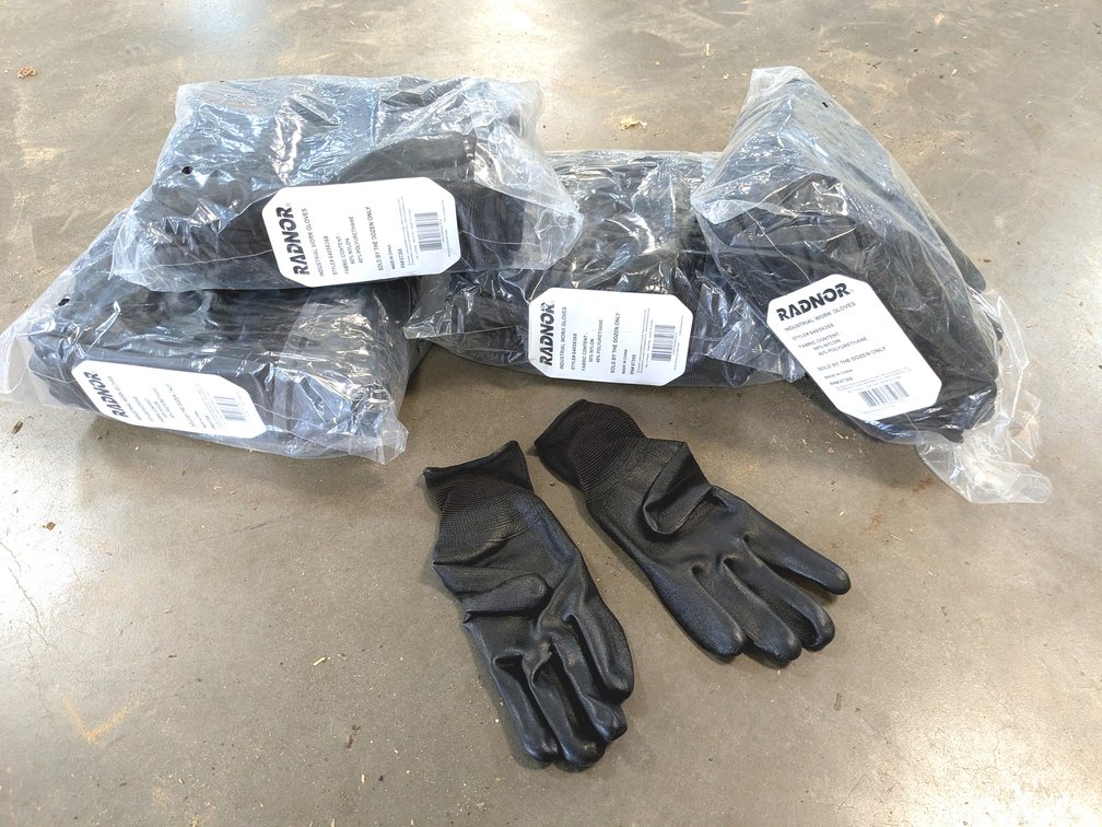 Three full and one partial package of Radnor gloves.