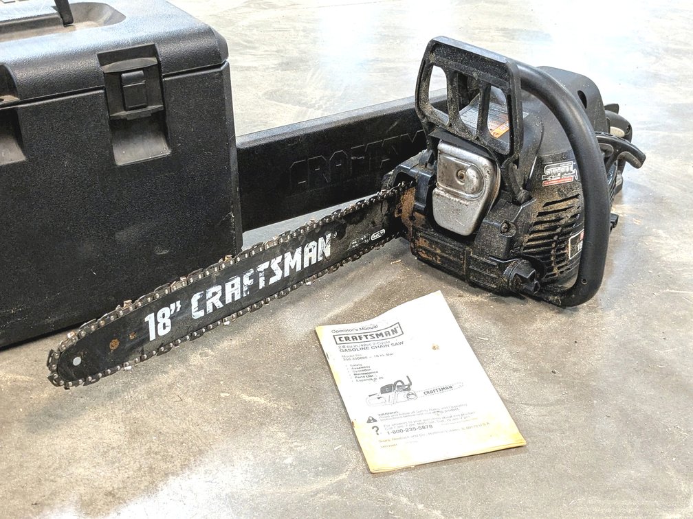 Craftsman chainsaw with an 18" bar, 42cc engine, Oregon chain and case.  Saw turns over and has very