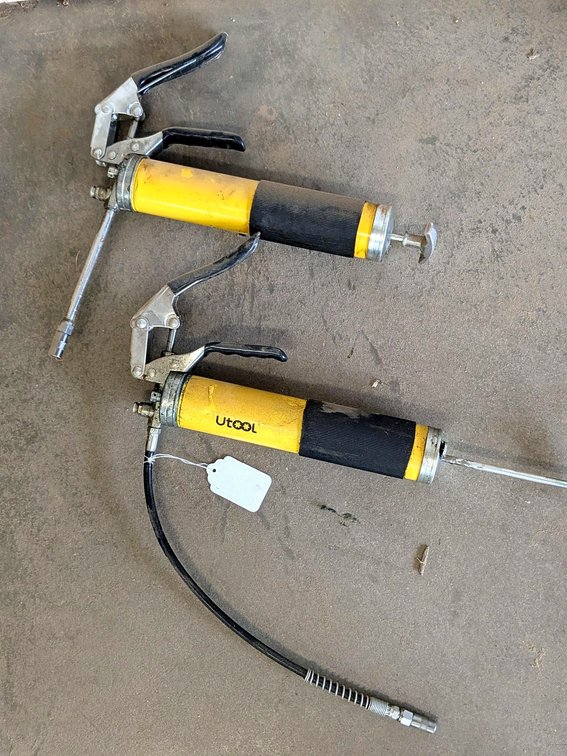 No shipping.  Two grease guns with flexible and standard nozzles.