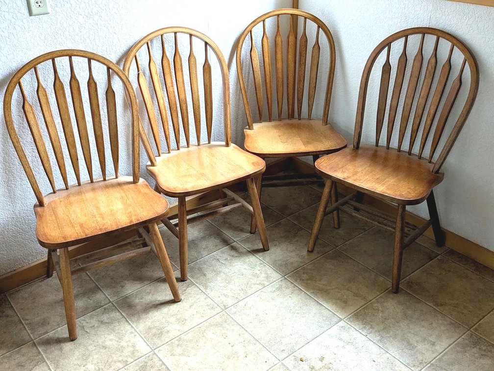 Four sturdy wooden chairs.