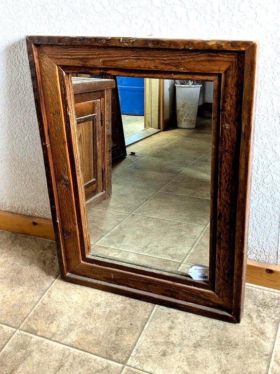 Rustic wooden framed mirror, measures 22" x 28" over frame.