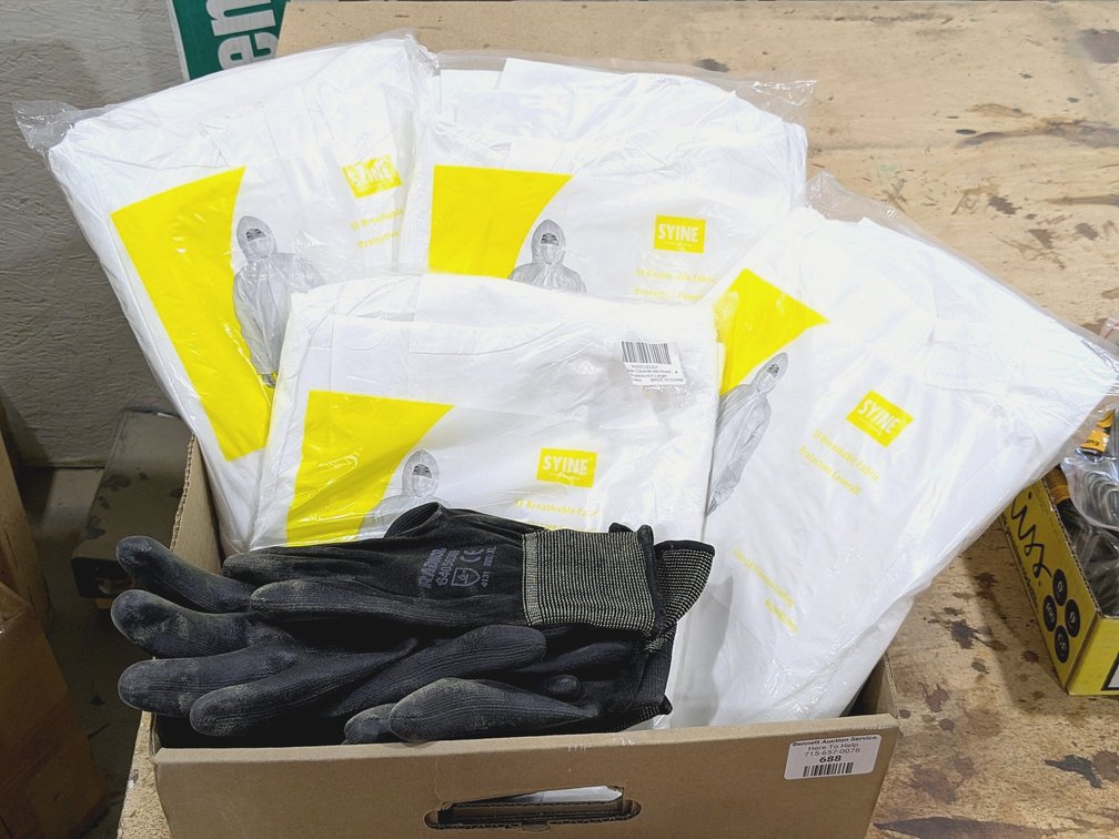 Syine protective coveralls with Radnor work gloves.  Coveralls are size XL.