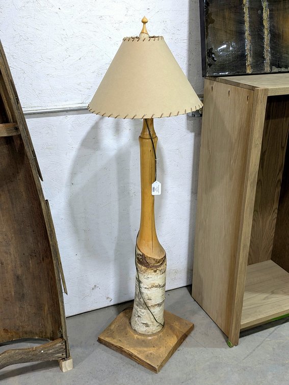 Birch floor lamp stands 63" tall.
