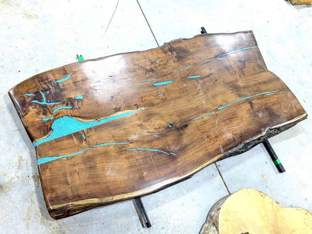 Black walnut live edge counter top with turquoise inlay.  Piece measures 68" x 34" x 2" thick.