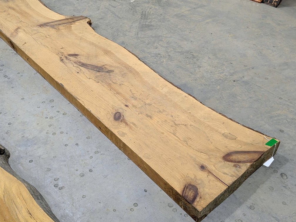 Live edge pine slab measures 104" x 22" at widest x 3" thick.