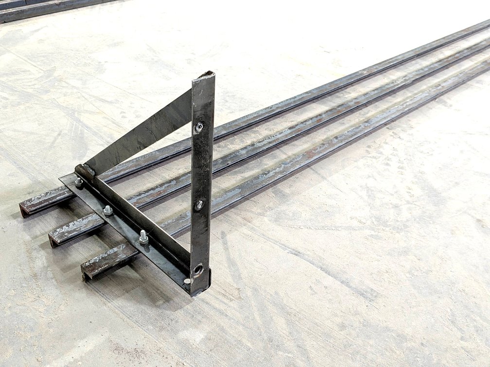 Heavy duty steel shelf measures 10' long and 12" wide.