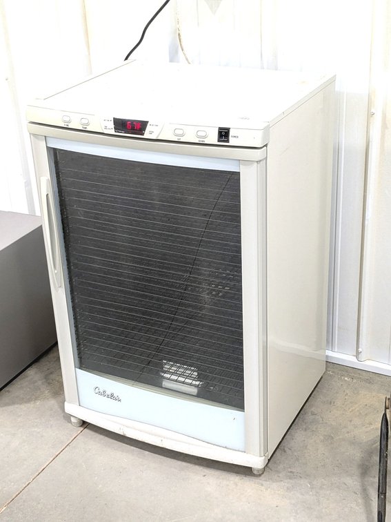 Cabela's dehydrator measures 24" x 20" x 3' tall.