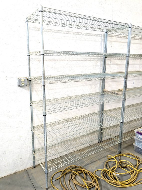 Steel shelving unit is 4' wide x 18" deep x 6' tall.