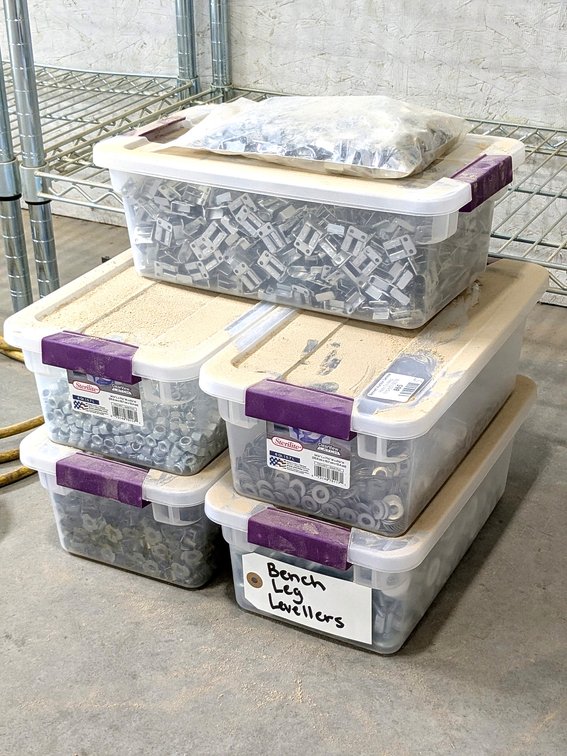 Five tote filled with nuts, washers, wood thread inserts and more.