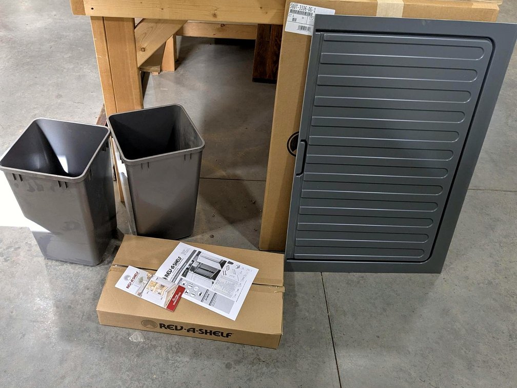 Rev-A-Shelf waste container pull-out with cans and more.