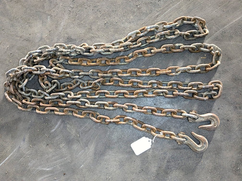Approx 15' of 5/16" chain with grab hooks, no repairs noted.