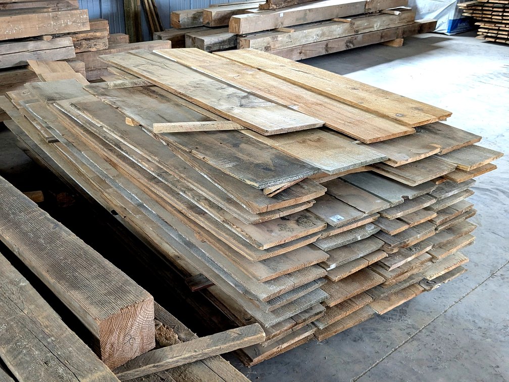 Bunk of reclaimed shiplap boards are 11" wide and about 10' long.
