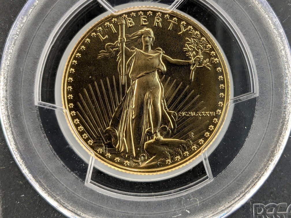 1986 $25 Gold Eagle has been slabbed and graded by PCGS MS69.