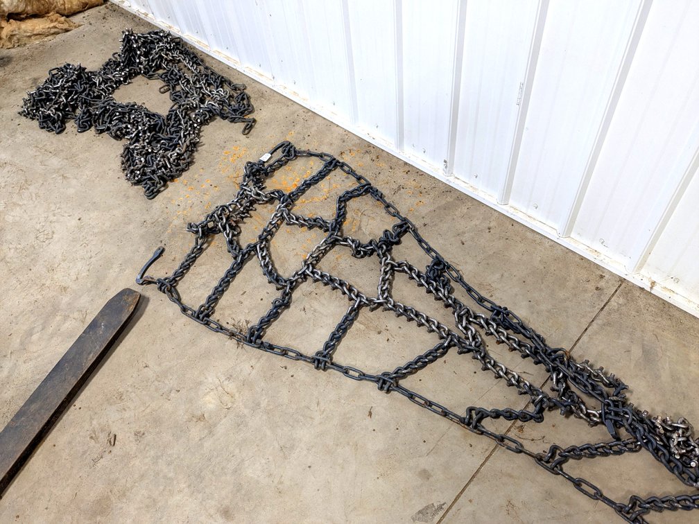 Pair of heavy duty cleated tractor tire chains, measure 33" by approx 11'.