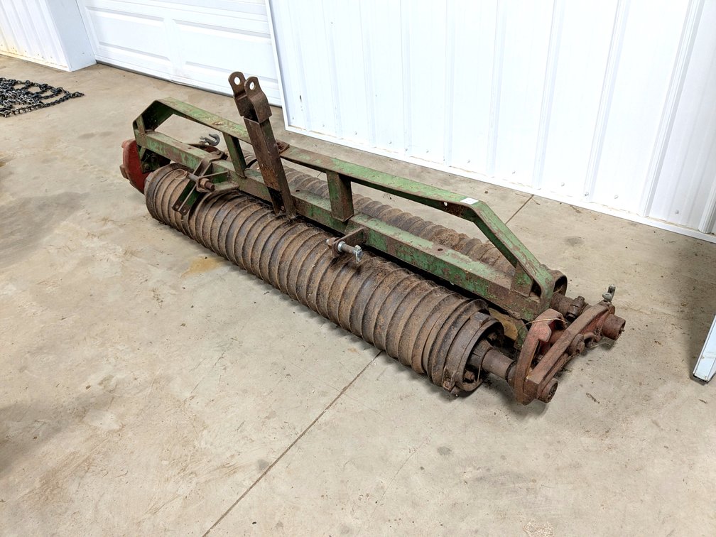 Bullion cultipacker, measures 7' wide.