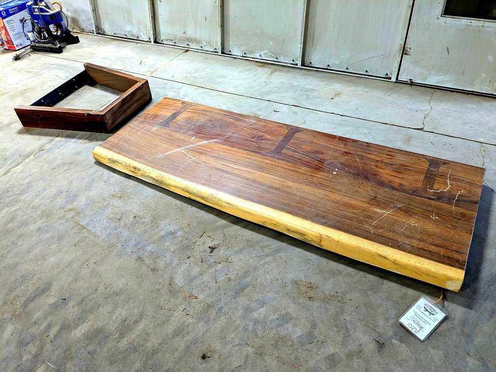 Roughing it in Style brand black walnut table with a matching walnut leaf. Top measures 82" x 30".