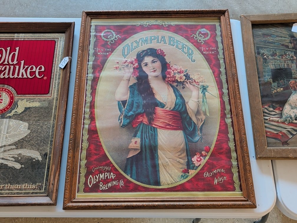 1907 Olympia beer sign with glass