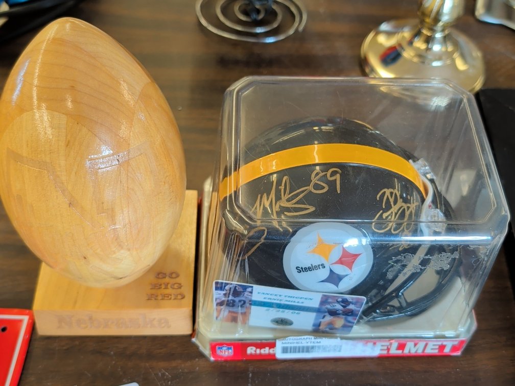 Autographed mini Steelers Helmet & Wood Nebraska Ball