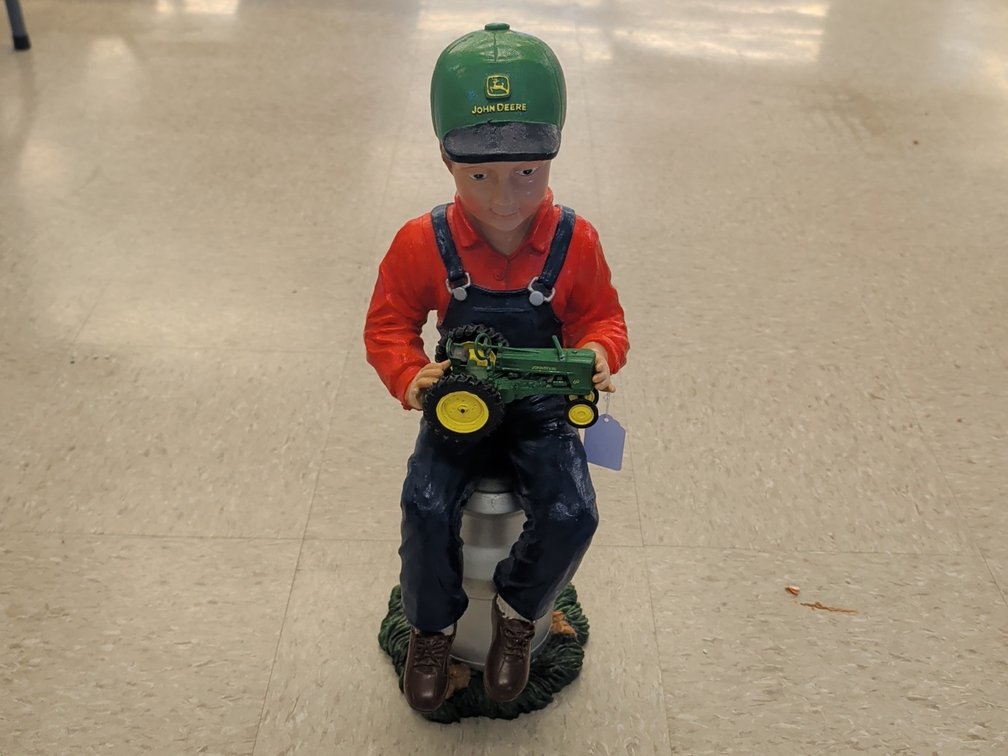 SpecCast John Deere statue holding model 60