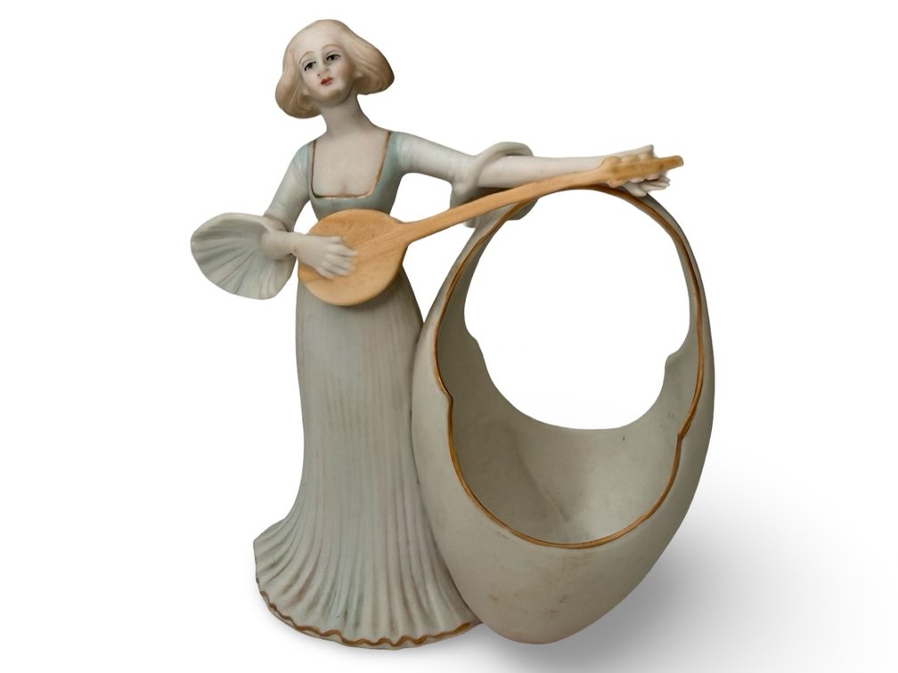 Bisque Porcelain Figurine with Egg-Shaped Vessel