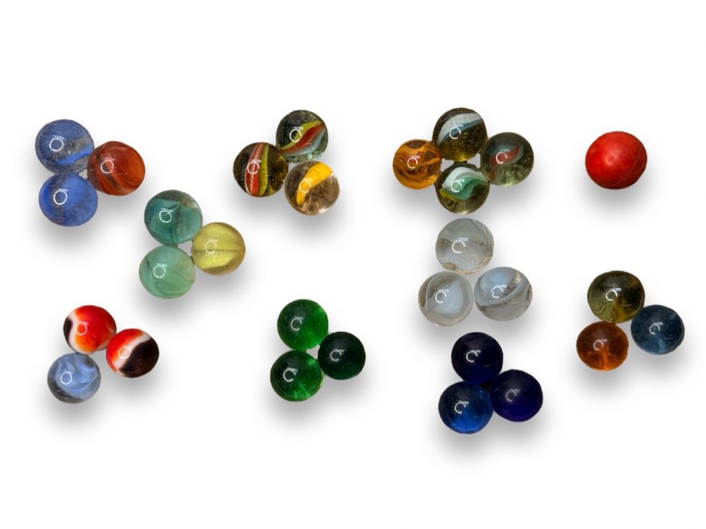 Glass Marbles and Red Molded Plastic Ball