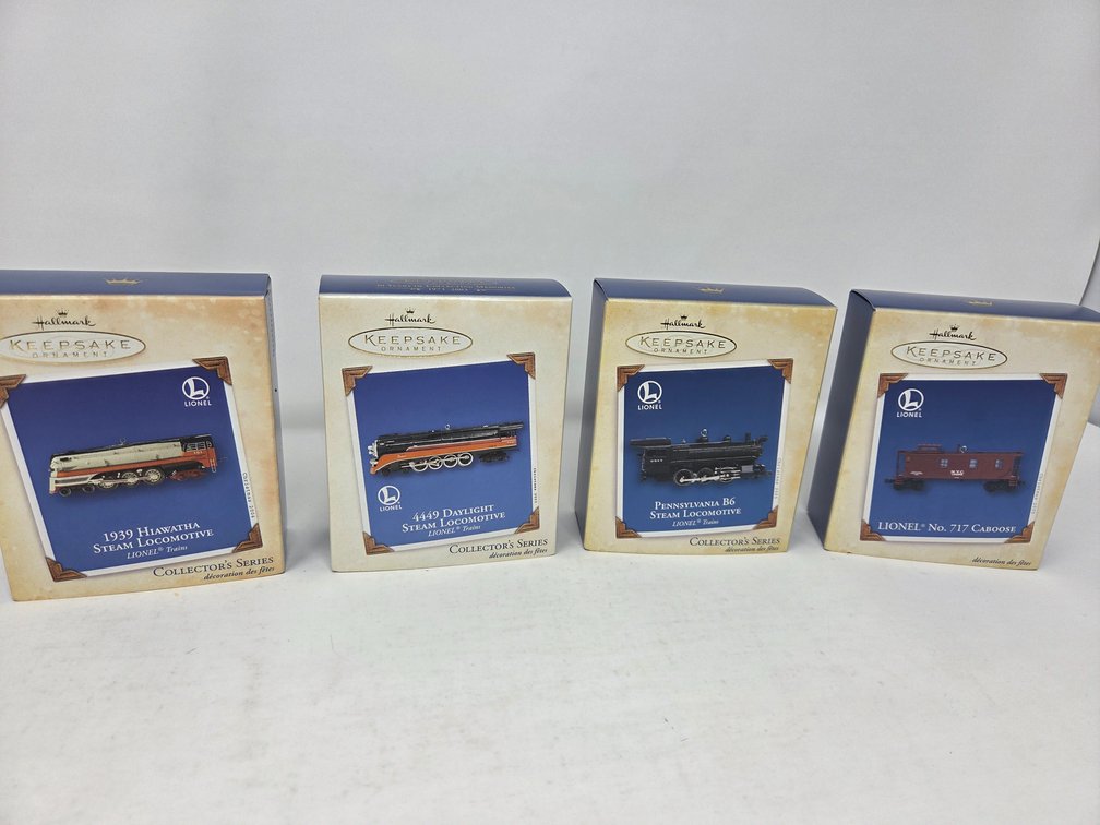 4 Assortment of Hallmark  Trains