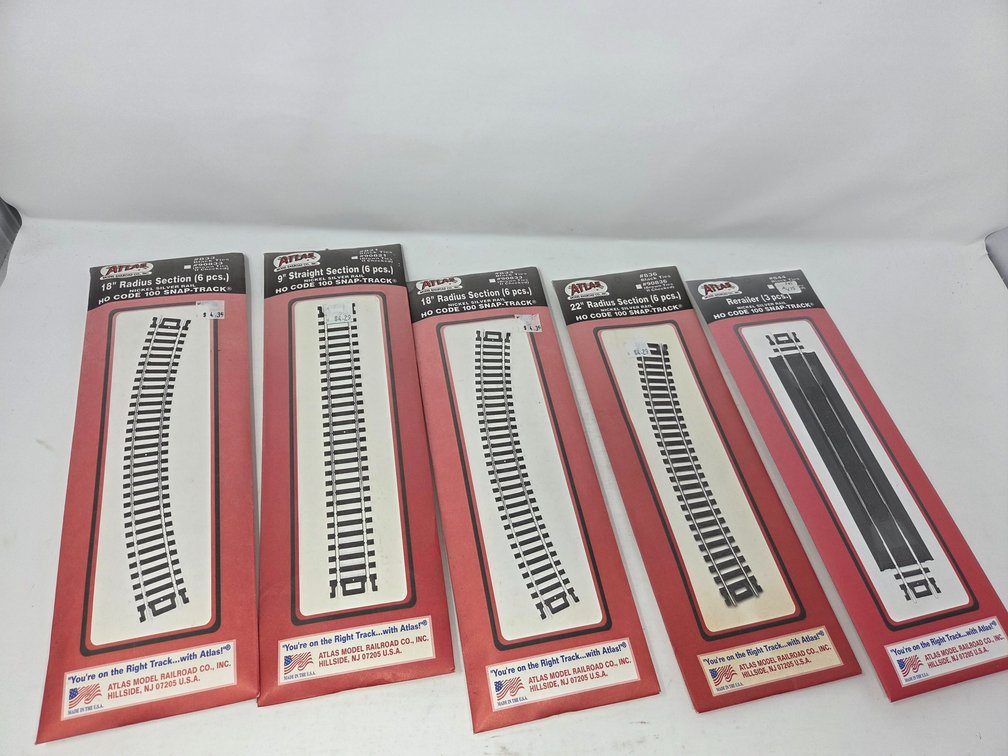 5 - Packs of Assortment of HO Scale Atlas Tracks, 1 of the Packs has most of them missing