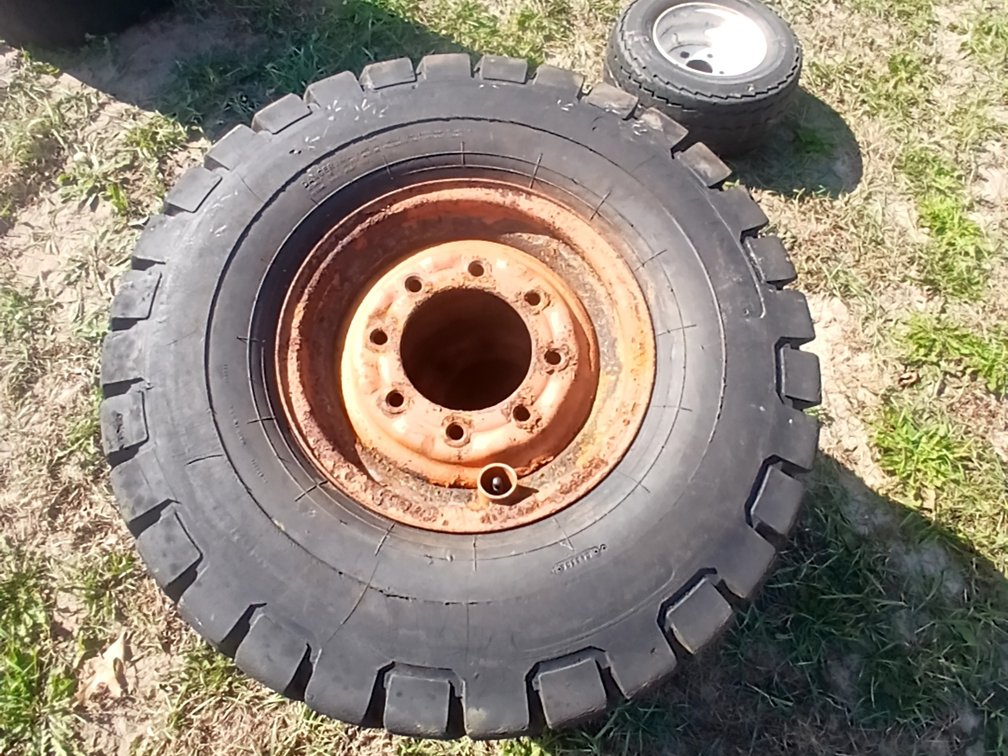 3 Carlisle 8.25 - 15 NHS Tires on 8 Bolt Rims