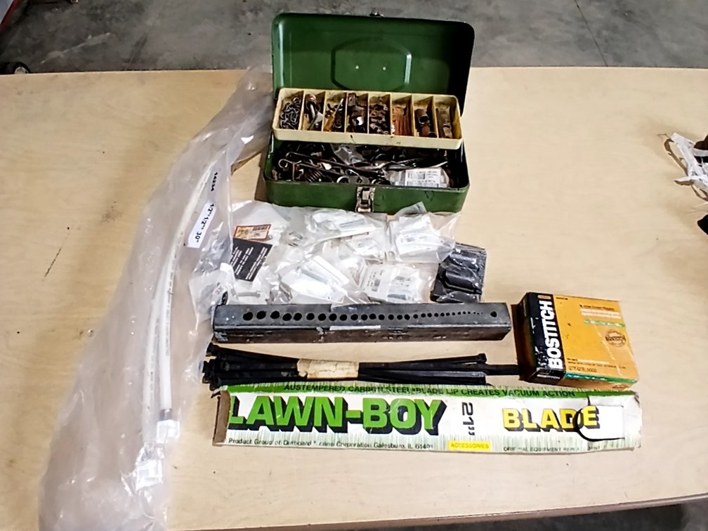 Box of Misc-Plumbing, Staples, Lawnmower Blade, Bit Holder, etc