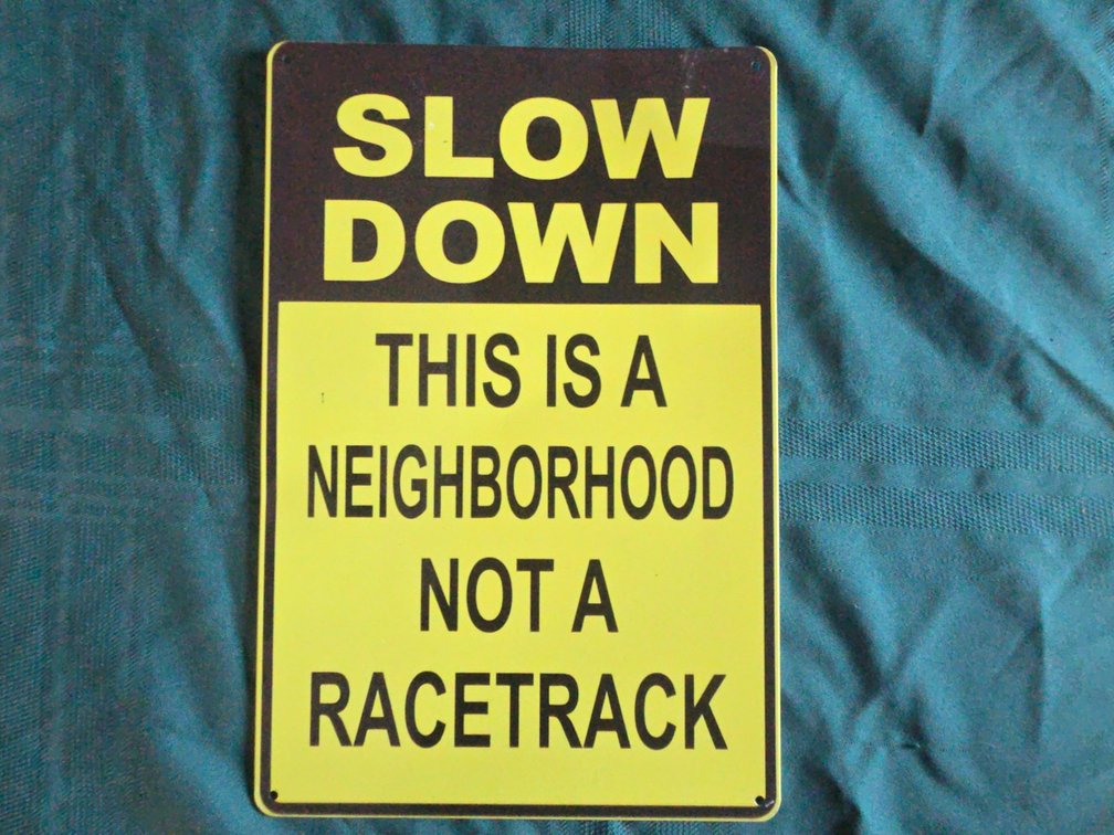 Slow Down Metal Sign