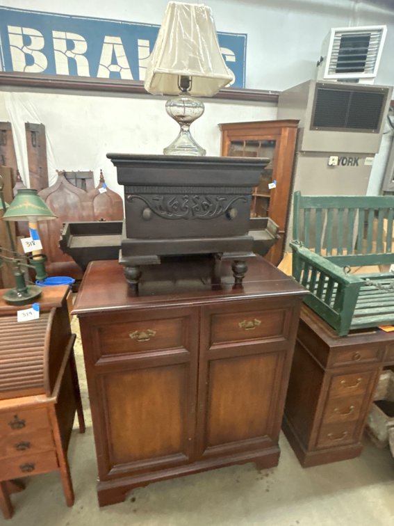 Two-Door Wood Cabinet, Carved Box, and Glass Table Lamp