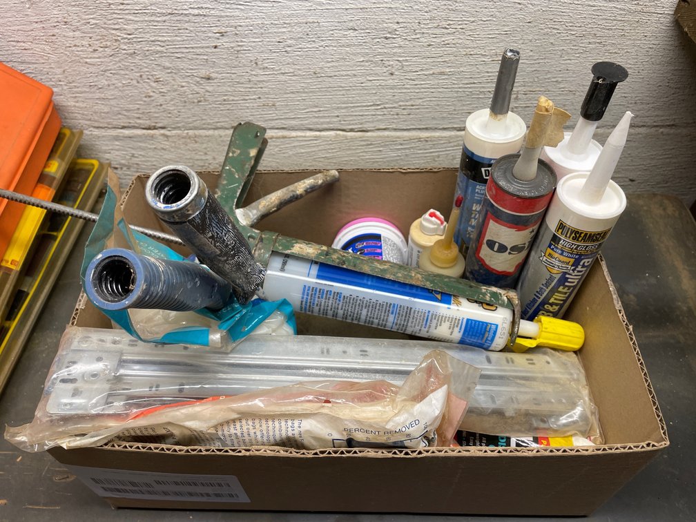 box of caulk with supplies