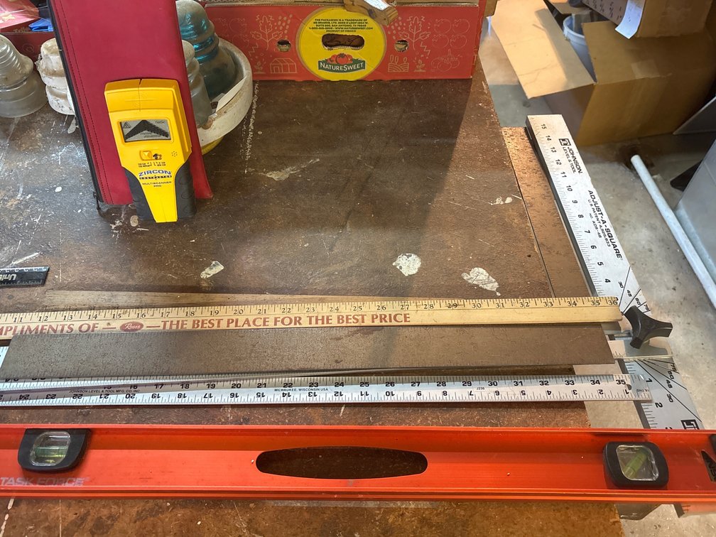 Variety of rulers, level, and a stud finder