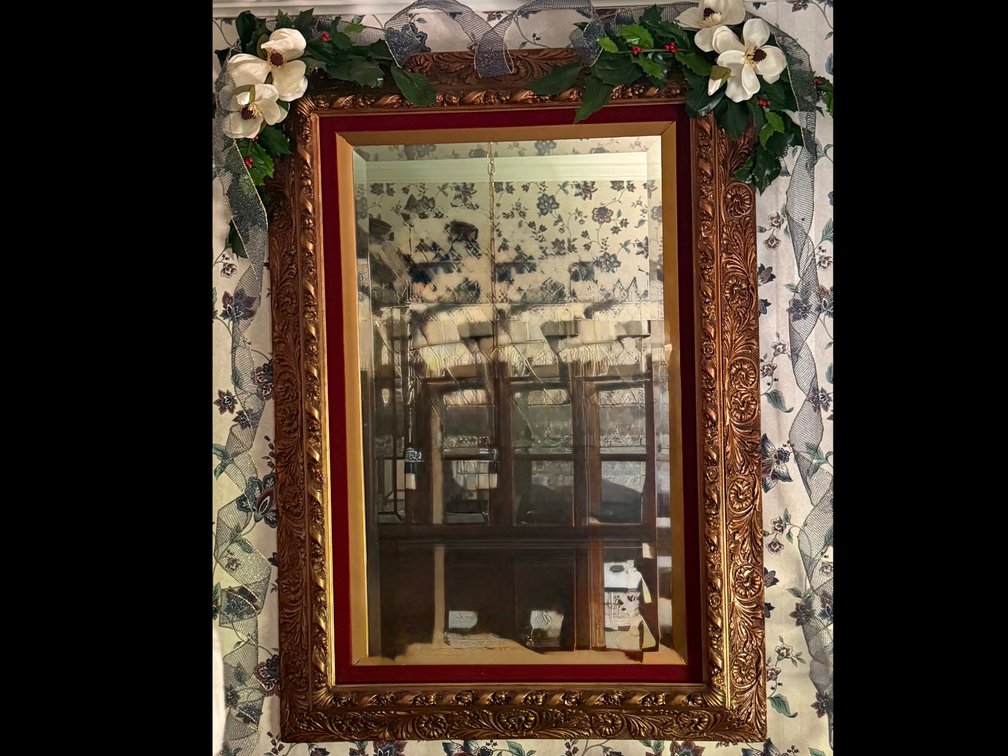 Intricately Gilded Mirror with velvet accent