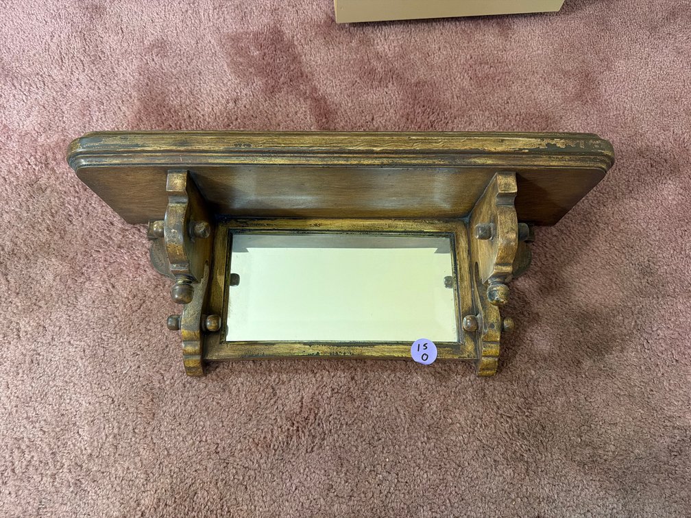 Vintage wooden wall shelf with a built-in mirror