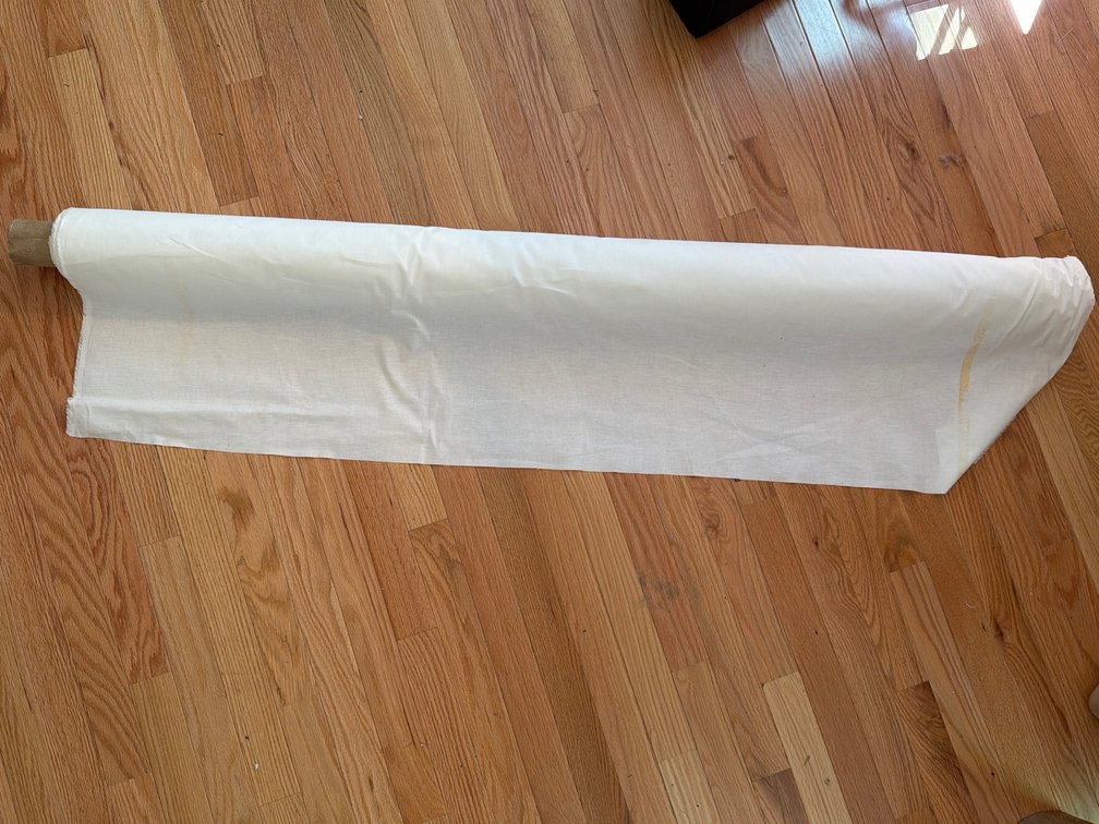 Uncut Roll of Natural Off-White Utility Fabric on Cardboard Spool