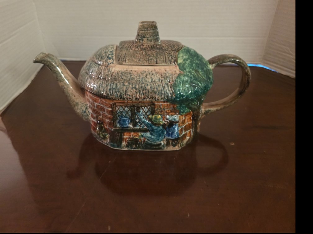 Vintage ceramic novelty teapot featuring an English cottage motif with a textured thatched roof, made by Tony Wood Staffordshire Pottery in England