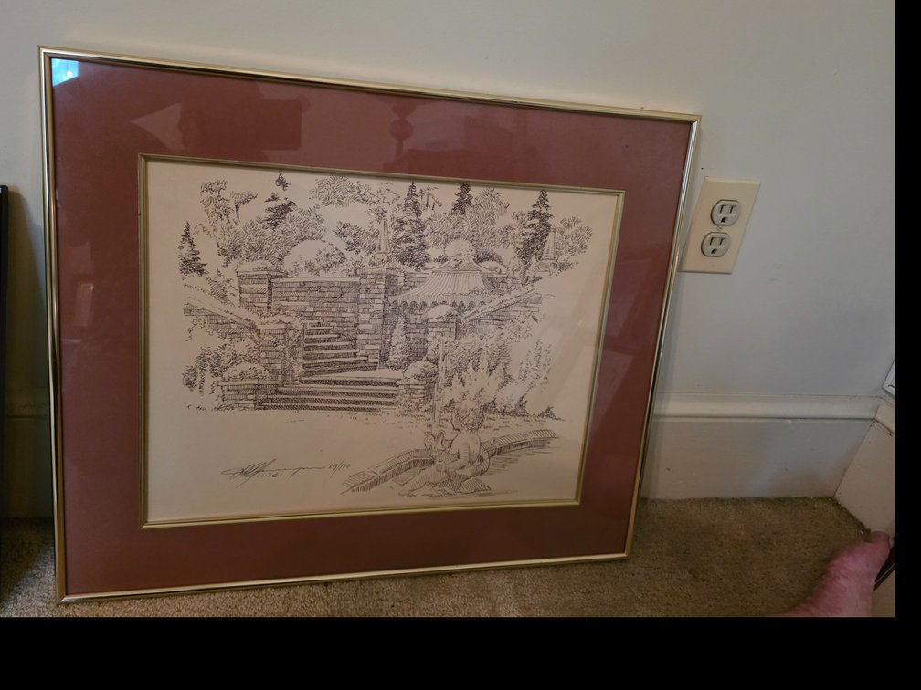 Framed pen-and-ink or pencil landscape drawing featuring trees, a rustic structure or building