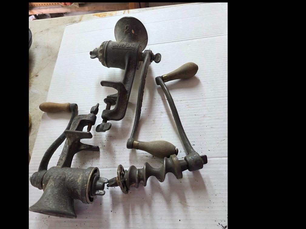 Vintage cast iron Universal No. 2 food chopper and meat grinder made by Landers, Frary & Clark: metal auger (feed screw) and crank handle from a manual cast-iron meat grinder, etc