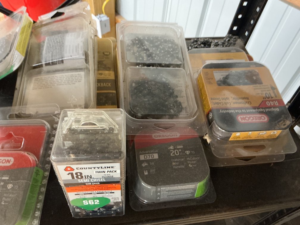 Shelf Lot Of Chain Bars, Chains, Chainsaw Oil