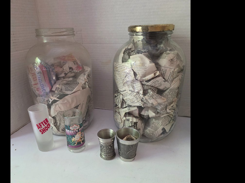 Gallon Jars filled with Shot Glasses